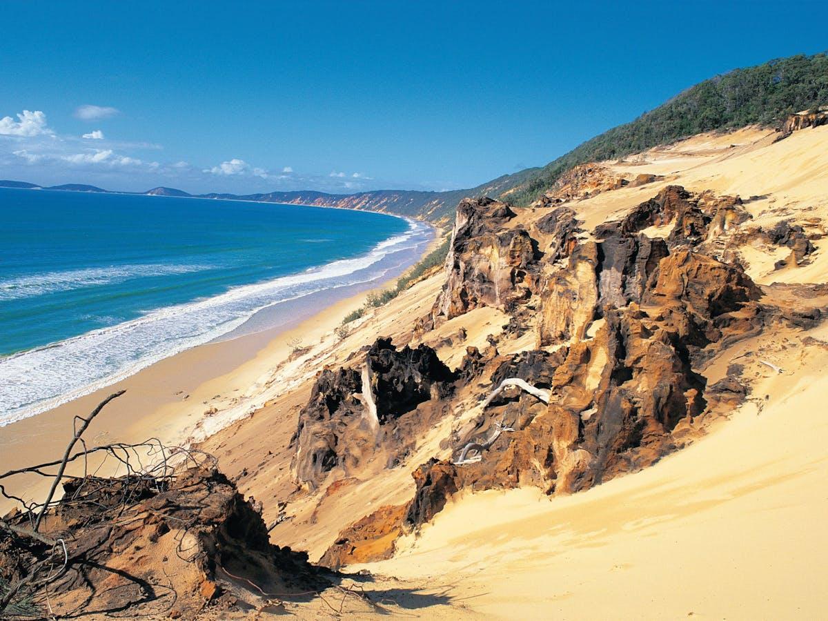 Cooloola National Park coastal dunes showing the distinctive golden sand formations and vegetation typical of the region